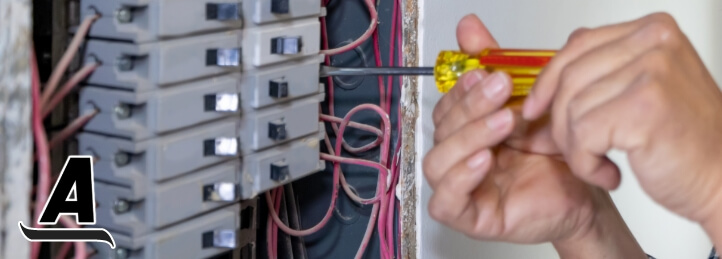 Person working on an electrical panel